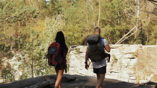 Hiking Couple Comes to the Cliff