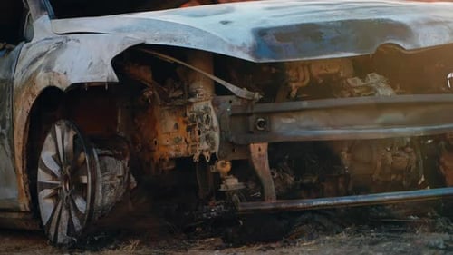 Burnt Car Aftermath in Urban Setting