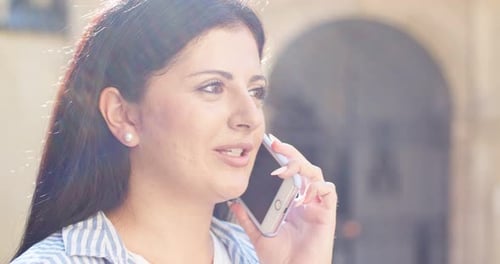 Side View of Smiling Female Lady Calling Friend Family on City Street Adult Caucasian Woman Talking