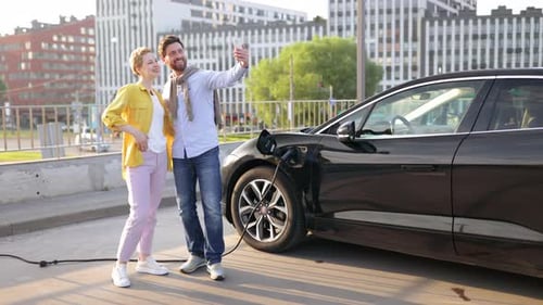 Couple Taking Selfie at EV Charger