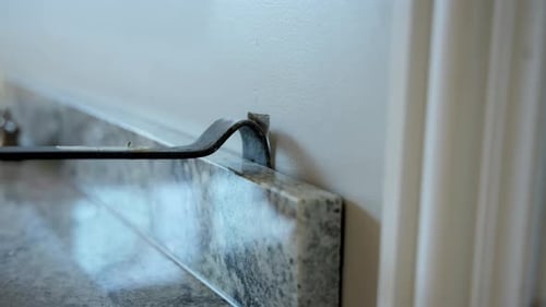 Close Up View of Hands Working with Electrical Wires and Outlet Box During Home Repair Installation