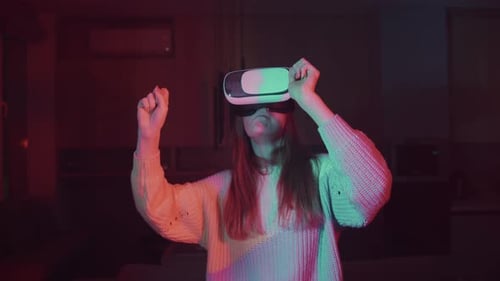 Woman Immersed in Virtual Reality Experience with VR Headset