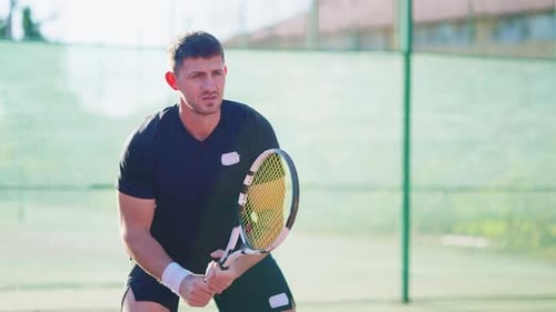 Tennis Player Hitting Ball on Court
