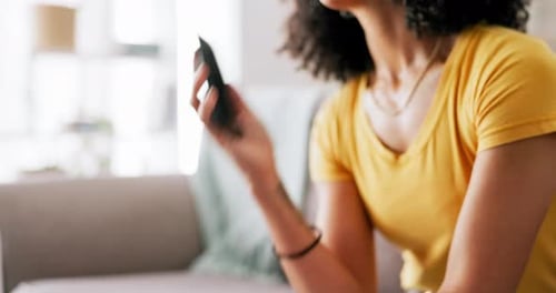 Woman with Curly Hair Talking on Cellphone