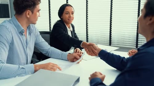 Business Meeting: Handshake in Bright Modern Office