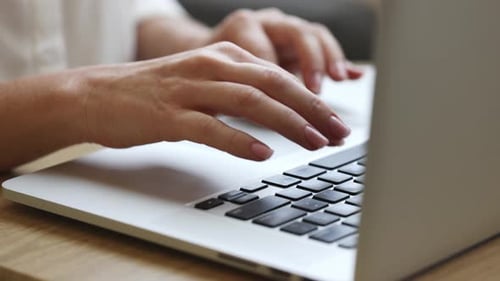 Female Freelancer Using a Laptop at the Home Office Hands in Frame