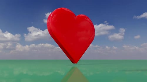 Red Heart in a surreal landscape green reflective surface and cloudy sky