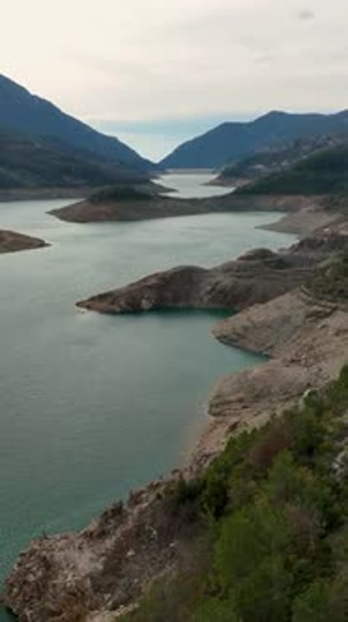 Vertical Video Tranquil Mountain Reservoir and Vibrant Farming in Southern Turkey