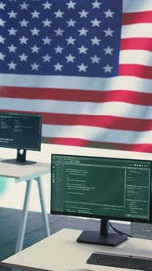 Computers Displaying Code with an American Flag