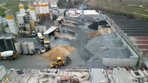 Construction raw material dispensing ground drone shot