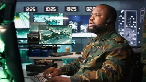 Man Working in High-Tech Surveillance Office