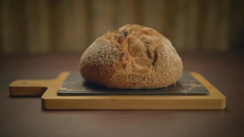 Rustic Loaf of Bread on Cutting Board