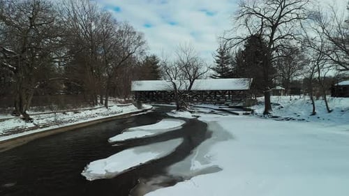 Aerial Shot of a Snowy Covered Bridge American Suburbs