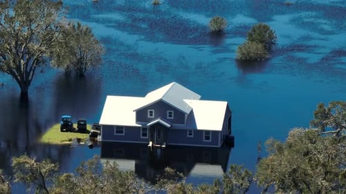 Heavy Flood with High Water Surrounding Residential Farm House After Hurricane Ian Rainfall in