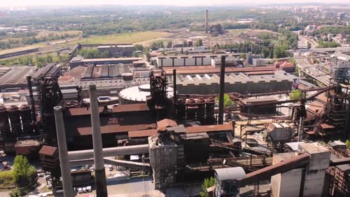 Industrial complex aerial drone shot fly backward reveal Ironwork, coal mines, blast furnace in hist