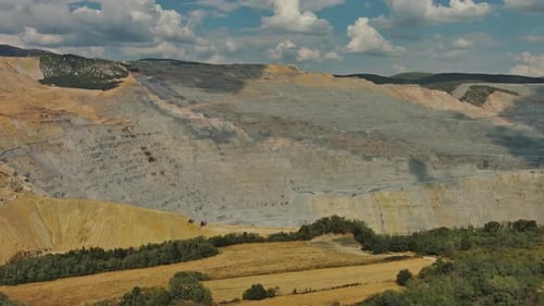 Aerial of Open Mine and Heavy Mining Equipment