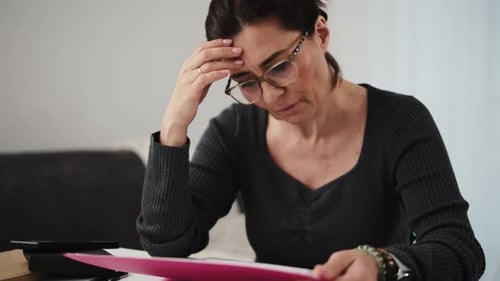 Woman Working On Documents From Home