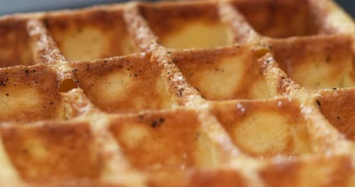 Powdered Sugar Sprinkled on Golden Brown Waffle