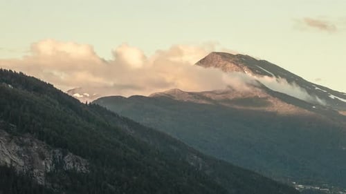 Timelapse of a mountain where clouds are passing by