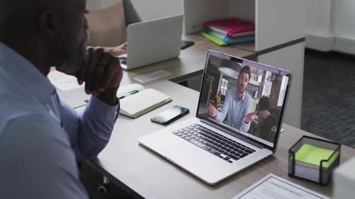 Office Team Having an Online Meeting on Laptop