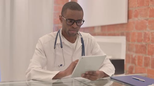 Doctor using Tablet in Modern Office Setting