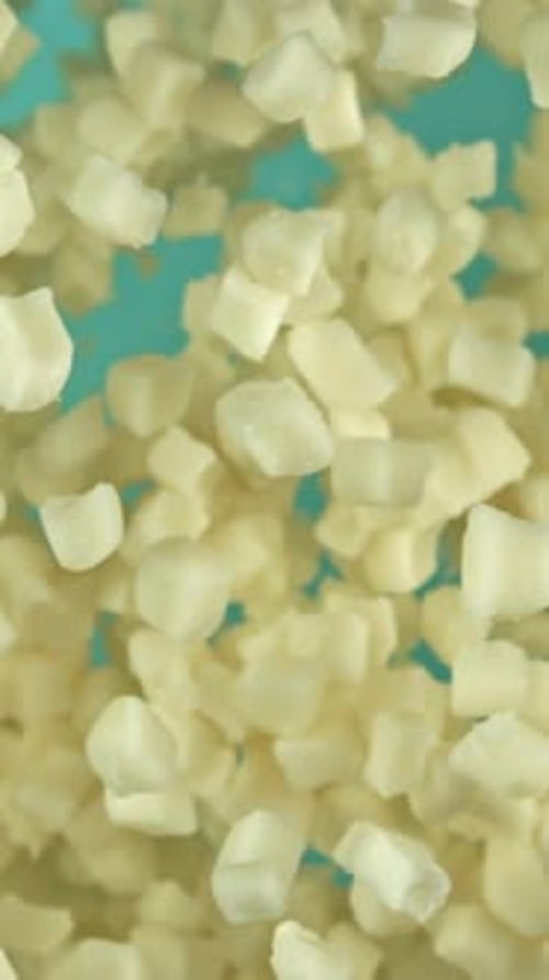 Slices of Mozzarella Cheese Fly Up on a Blue Background Filmed on a Highspeed Camera at 1000 Fps