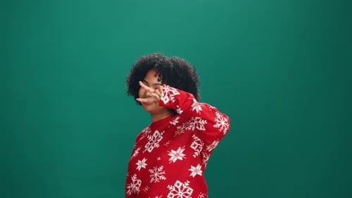 Christmas, dance and face of woman in studio for December celebration or holiday cheer on space