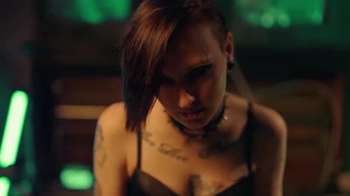 Close Up of Woman with Tattoos and Hair