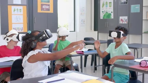 Biracial students explore virtual reality in a school, with copy space