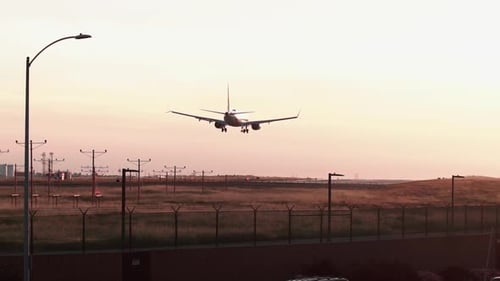 Jet airliner landing on runway.