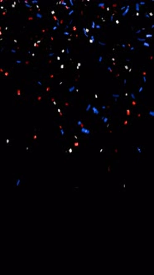 uk themed falling confetti on black background. decorative confetti for party celebrations