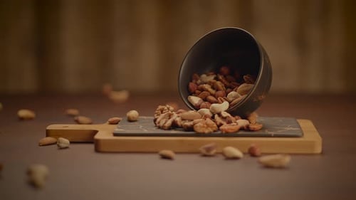 Delicious Assortment of Mixed Nuts with Human Hand