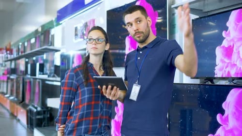 In the Electronics Store Professional Consultant Provides Expert Advice on Tablet Computer Specific