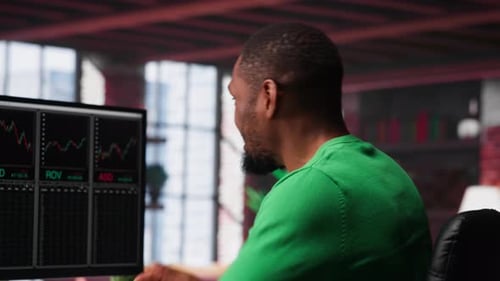 Male Investor Clapping Hands in Excitement After Gaining Money By Selling Stock