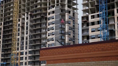 A Construction Crane on the Construction Site of a Multistorey Building