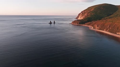 Two Rocks in the Ocean at Dawn