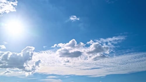 Sunny Blue Sky with White Puffy Clouds