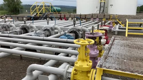 Exploration shot of the various fuel pipes leading to the large storage containers