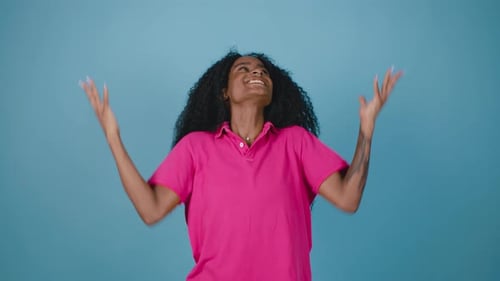 Woman Celebrates Success in Studio Setting