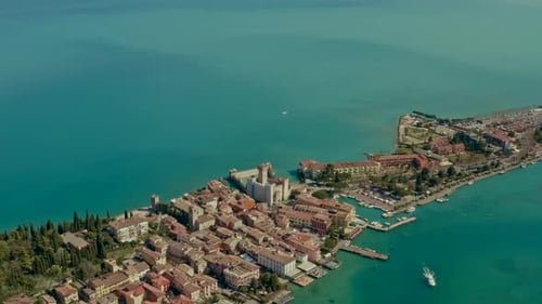 Drone shot over sirmione castle, Garda Lake, Italy