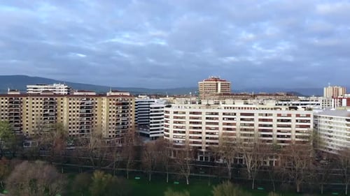 Aerial skyline of city with white buildings and green park
