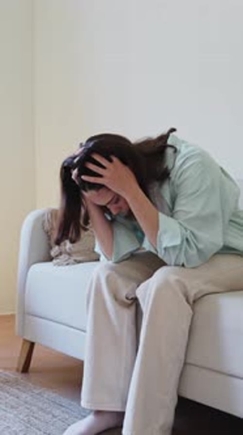 Woman Suffering From Anxiety Attack at Home