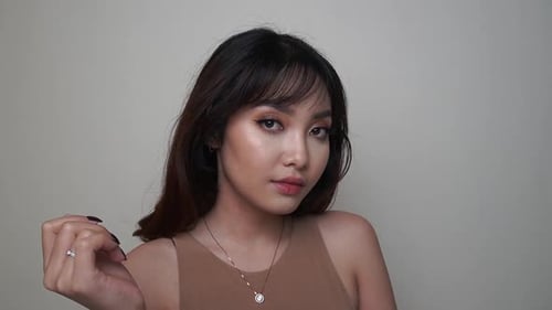 Beautiful Woman Smiling and Posing with Dark Hair