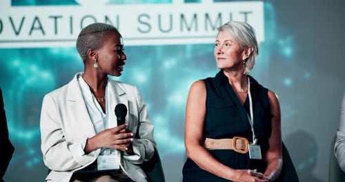 Panel, microphone and stage with business women at conference for finance summit