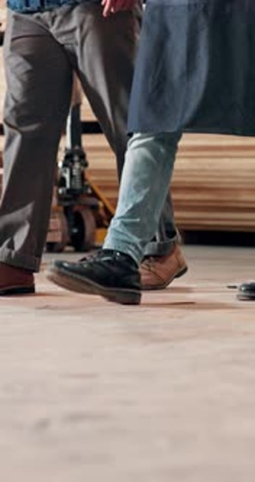 Carpentry, walking and legs of people in workshop, maintenance project and production development