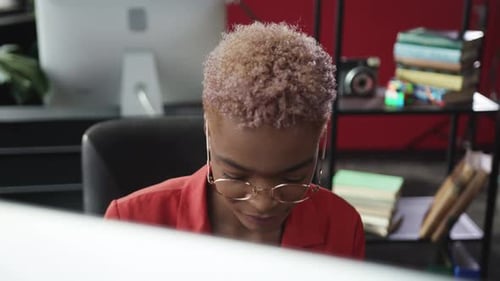 Dedicated and Focused Professional at Work in a Dynamic and Modern Office Setting