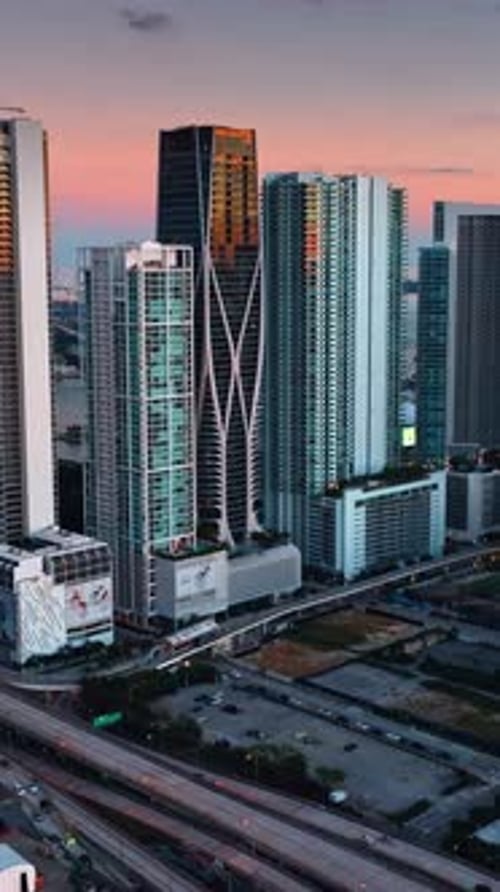 Gorgeous skyscrapers in Miami downtown. Amazing pink and blue sky at the backdrop. Vertical video