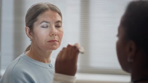 Doctor Checking Patient Eyes with Medical Flashlight