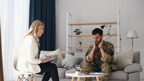 Man in Military Garb in Therapy Session