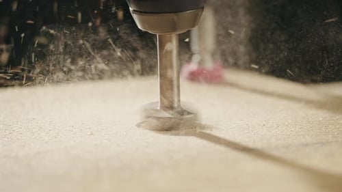 Drill Bit Boring Hole in Wood Board